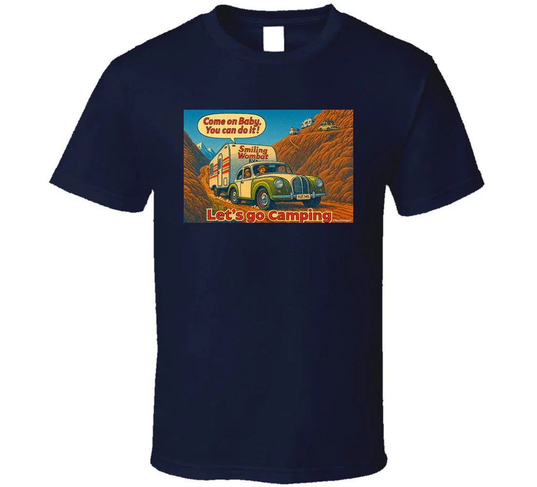 - “Smiling Wombat RV T-shirt featuring vintage-style car towing trailer up mountain with ‘Come on Baby’ slogan”
