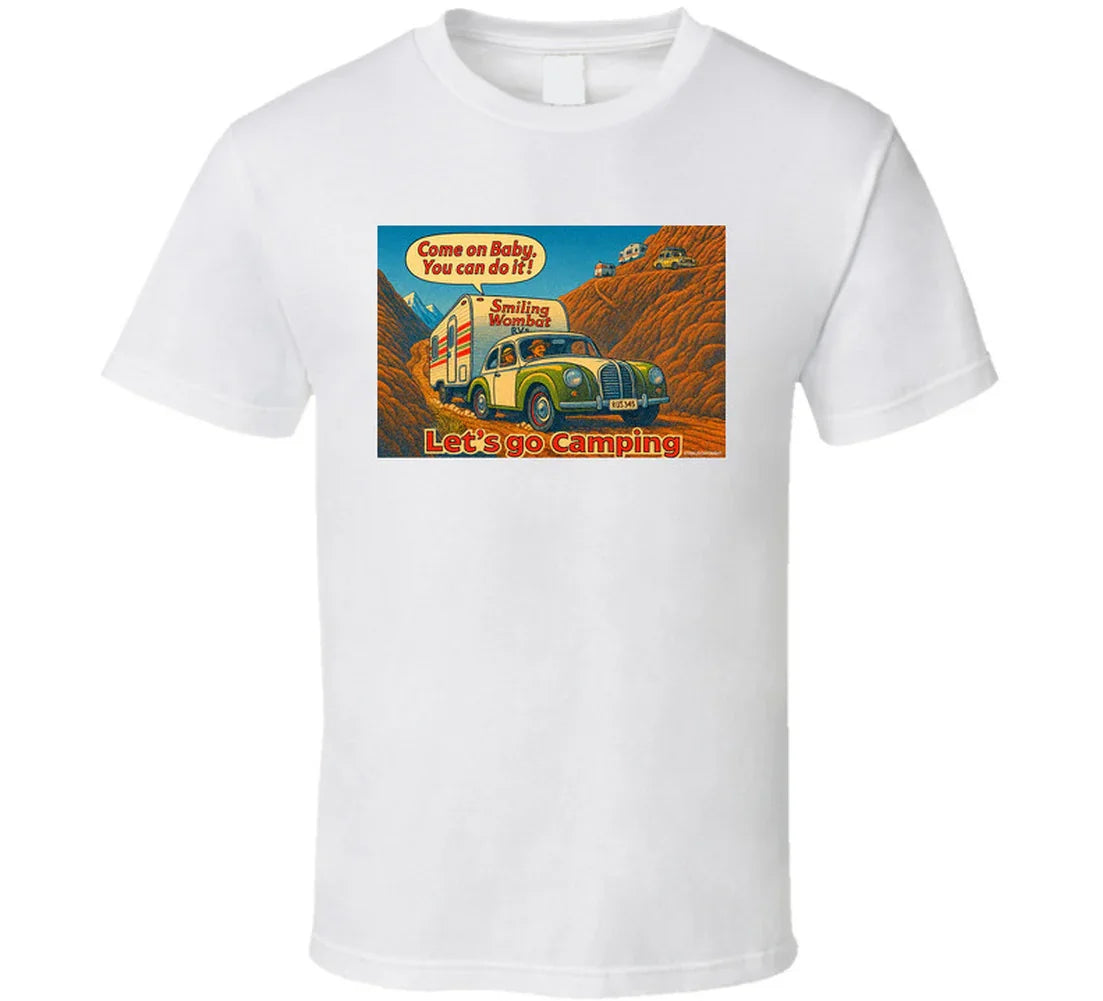 - “Smiling Wombat RV T-shirt featuring vintage-style car towing trailer up mountain with ‘Come on Baby’ slogan”
