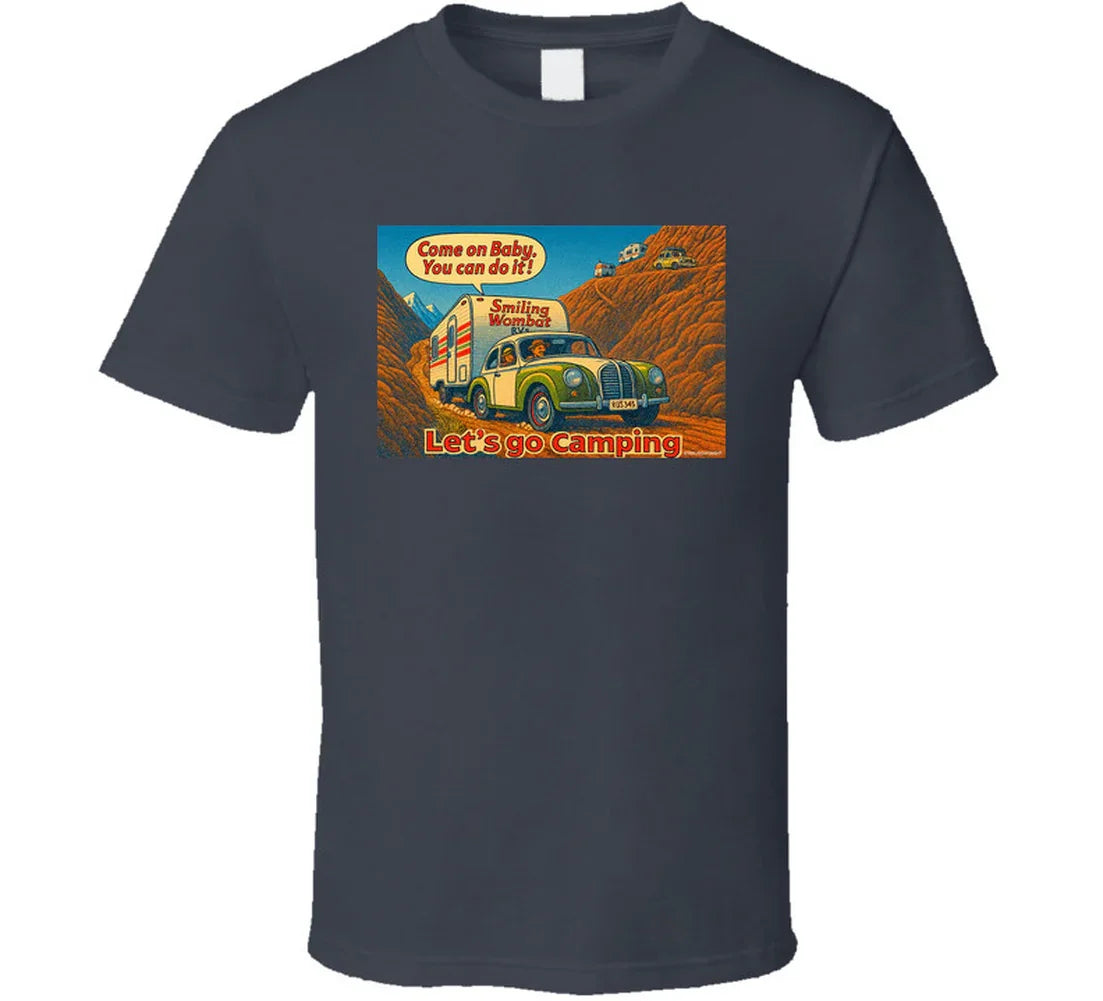 - “Smiling Wombat RV T-shirt featuring vintage-style car towing trailer up mountain with ‘Come on Baby’ slogan”
