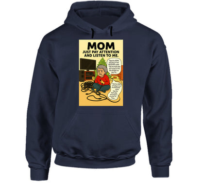 “Smiling Wombat hoodie with tangled cords, frustrated mom, and Christmas tree background”