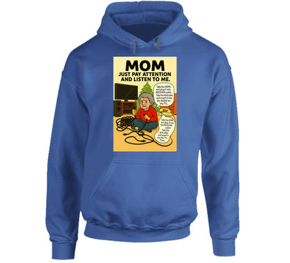 “Smiling Wombat hoodie with tangled cords, frustrated mom, and Christmas tree background”